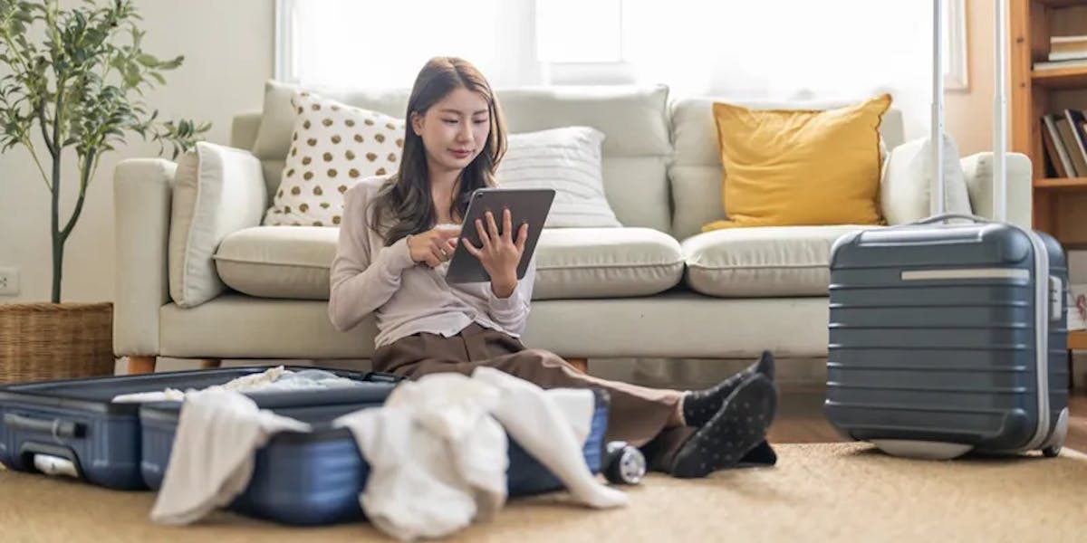 woman booking travel packing